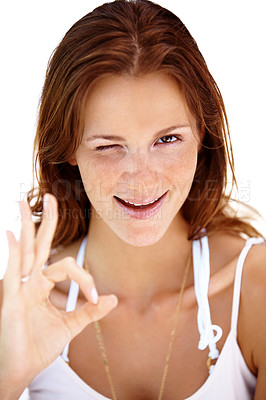 Buy stock photo Portrait of happy young lady giving ok sign and winking