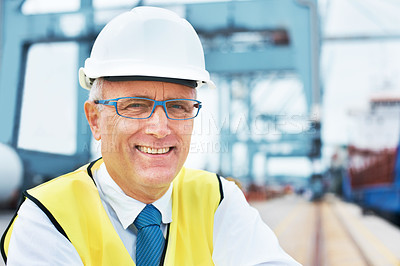 Buy stock photo Portrait of a dock worker standing at the harbor amidst shipping industry activity