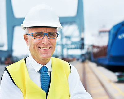 Buy stock photo Portrait of a dock worker standing at the harbor amidst shipping industry activity