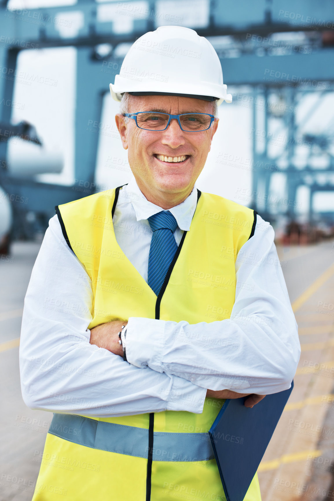 Buy stock photo Portrait of a dock worker standing at the harbor amidst shipping industry activity