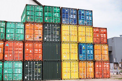 Buy stock photo Cargo freight containers stacked at a port. Shipping crates awaiting export or import at industrial depo or logistics warehouse. Bulk units unloaded at dockyard outside due to transport crisis delays