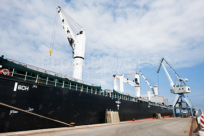 Buy stock photo Shipping, logistics and supply chain with a ship in a harbor for freight and cargo delivery. Shipment, courier and service with a commercial and industrial vessel in the export and transport industry