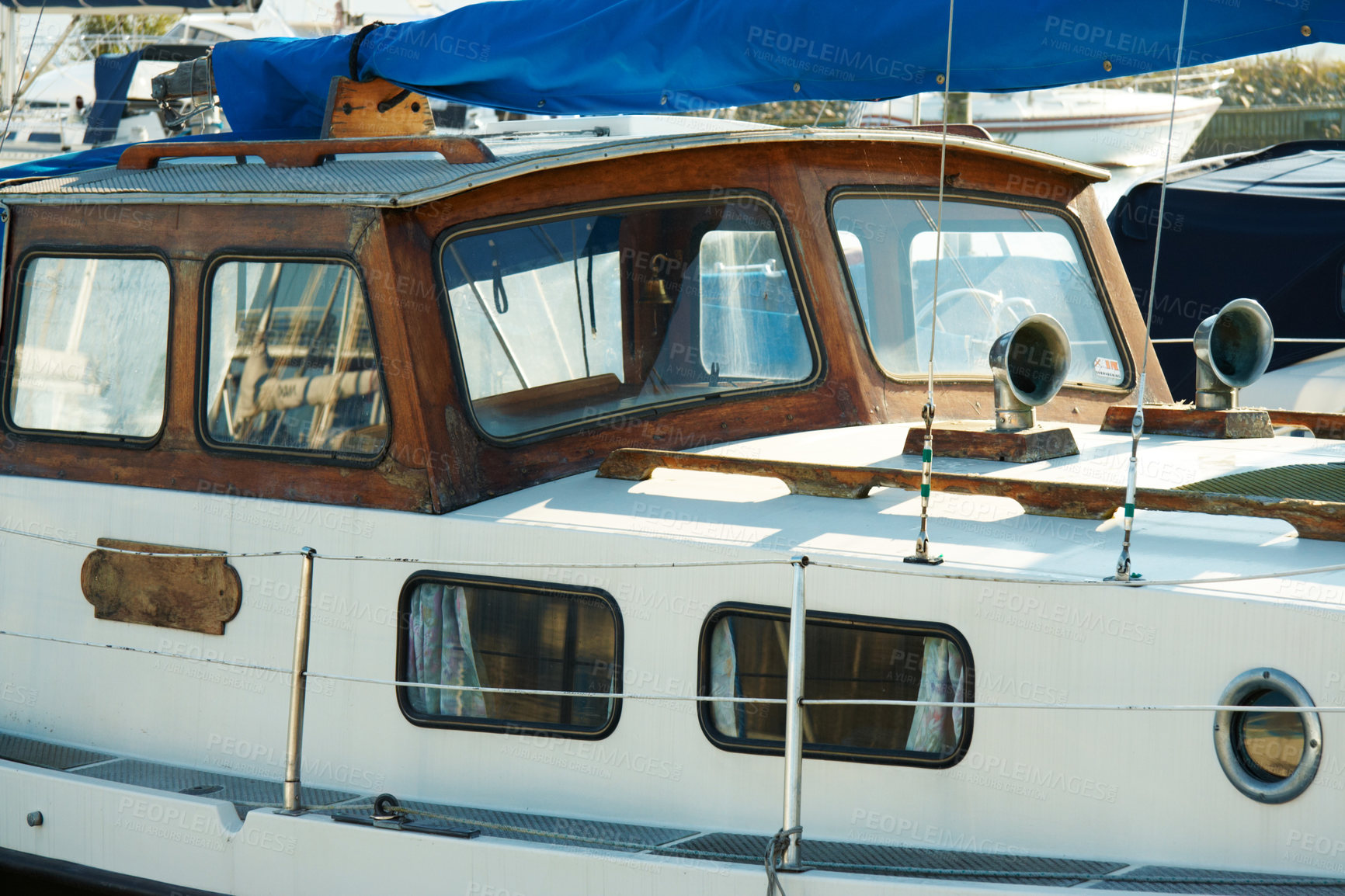 Buy stock photo Old sailboat from the side at a dock. Wooden yacht on the quay anchored in the harbour. Nautical transportation on the sea background. Vintage boat moored at lake yacht club with nobody