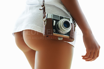 Buy stock photo Mid section of a curvaceous woman with a vintage camera on her hip