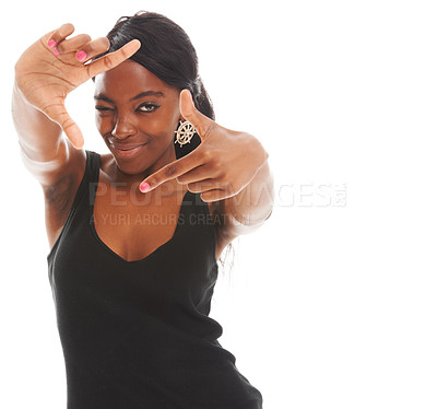 Buy stock photo Pretty young woman using her fingers to make a frame and smiling - copyspace