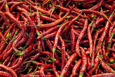 Buy stock photo Spicy, red pepper and grocery with chillies in supermarket for organic food, shopping and health. Mexican, plant and heat with hot vegetable ingredient in store for seasoning, paprika and nutrition