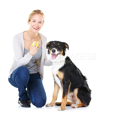 Buy stock photo Happy, woman and dog portrait with ball for playing, health and wellness of animal for marketing. Care, happiness and bond of girl with pet and tennis ball in white studio background with mockup.

