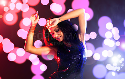 Buy stock photo Dance, party and new year with a woman in studio on a dark background with color flare for celebration. Event, music and nightlife with a female dancing against a black backdrop with lights