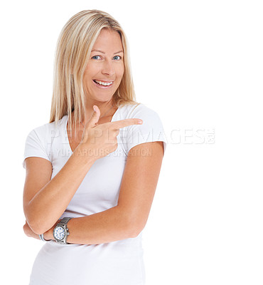 Buy stock photo Studio shot of an attractive woman pointing towards copyspace against a white backgroundon white