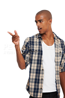 Buy stock photo Fashion, casual and man pointing in studio with a omg, wtf or surprise facial expression. Handsome, young and male model from Brazil with trendy, stylish and cool outfit isolated by white background.