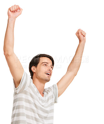 Buy stock photo Happy man, winner and hand up for success in competition, celebration and white background in studio. Positive person, cheer and smile with casual aesthetic for victory, good news or goal achievement