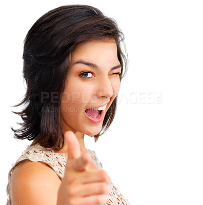 Buy stock photo Pretty young woman pointing at the camera and winking, isolated on white - copyspace