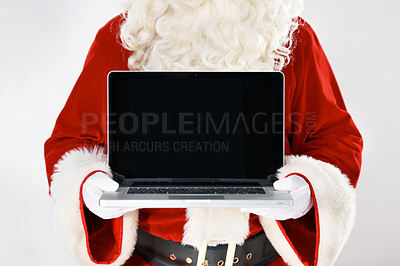 Buy stock photo Cropped portrait of Father Christmas holding a laptop - isolated on white