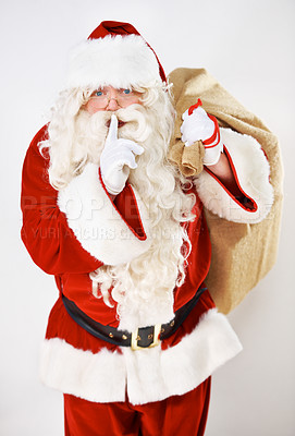 Buy stock photo Father christmas, santa and secret whisper of a fat holiday man with present and gift bag. Celebration event of a hush santa claus with glasses smile with celebration magic of gratitude holidays