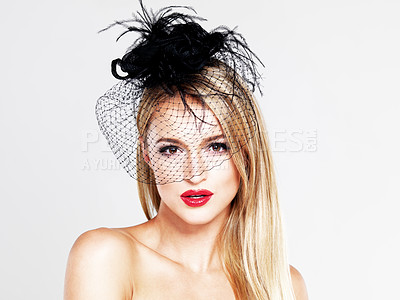 Buy stock photo A portrait of a glamourous blonde woman wearing a feather hat and red lipstick while isolated on white