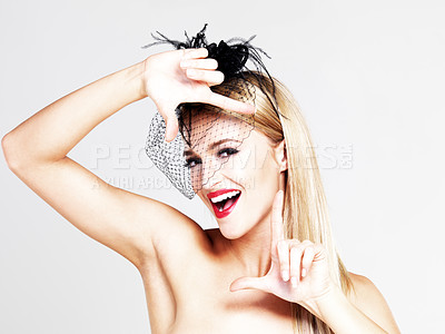 Buy stock photo Portrait, frame and woman with makeup, fashion and cosmetics on a white studio background. Face, person and model with a trendy hat, red lipstick and luxury grooming with aesthetic, smile and beauty