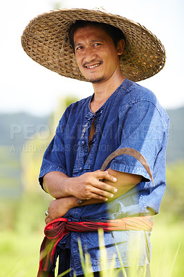 Buy stock photo Asian man, portrait and straw hat in farming, wheat or agriculture on rice field in outdoor nature. Happy male person or Thai smile on farm in plantation, gathering or natural sustainability on land