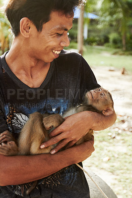 Buy stock photo Happy man with monkey, animal and pet at forest, jungle and outdoor in nature in summer. Person, friendship and trainer carrying macaque at park, wilderness and tourism at tropical zoo or shelter