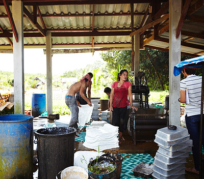 Buy stock photo Rubber, manufacturing and people in workshop, factory and production warehouse outdoors. Business, plantation and workers with package for industrial process, plastic or material resource in Thailand