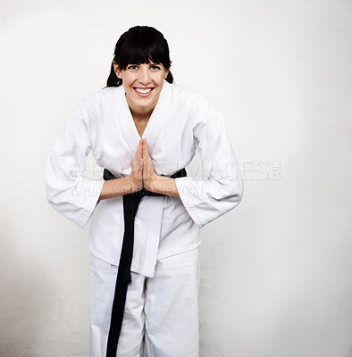 Buy stock photo Woman, karate and bow in portrait, fight and self defense sport, muay thai and training with respect. Athlete, combat and fitness, martial arts and warrior energy with taekwondo and wall background