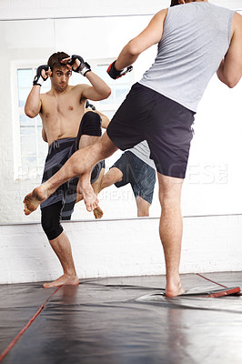 Buy stock photo Kickboxing, MMA and men fight in gym, training and fitness with power, strong and martial arts for sport. Exercise, workout and athlete in dojo, competition or contest with boxer, action and muscle