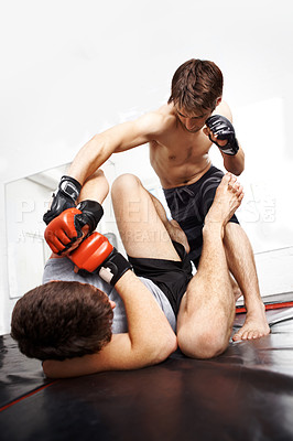 Buy stock photo Martial arts, MMA and men fight, training and fitness with power, strong and kickboxing for sport in gym. Exercise, workout and athlete in dojo, competition or contest with boxer, action and muscle
