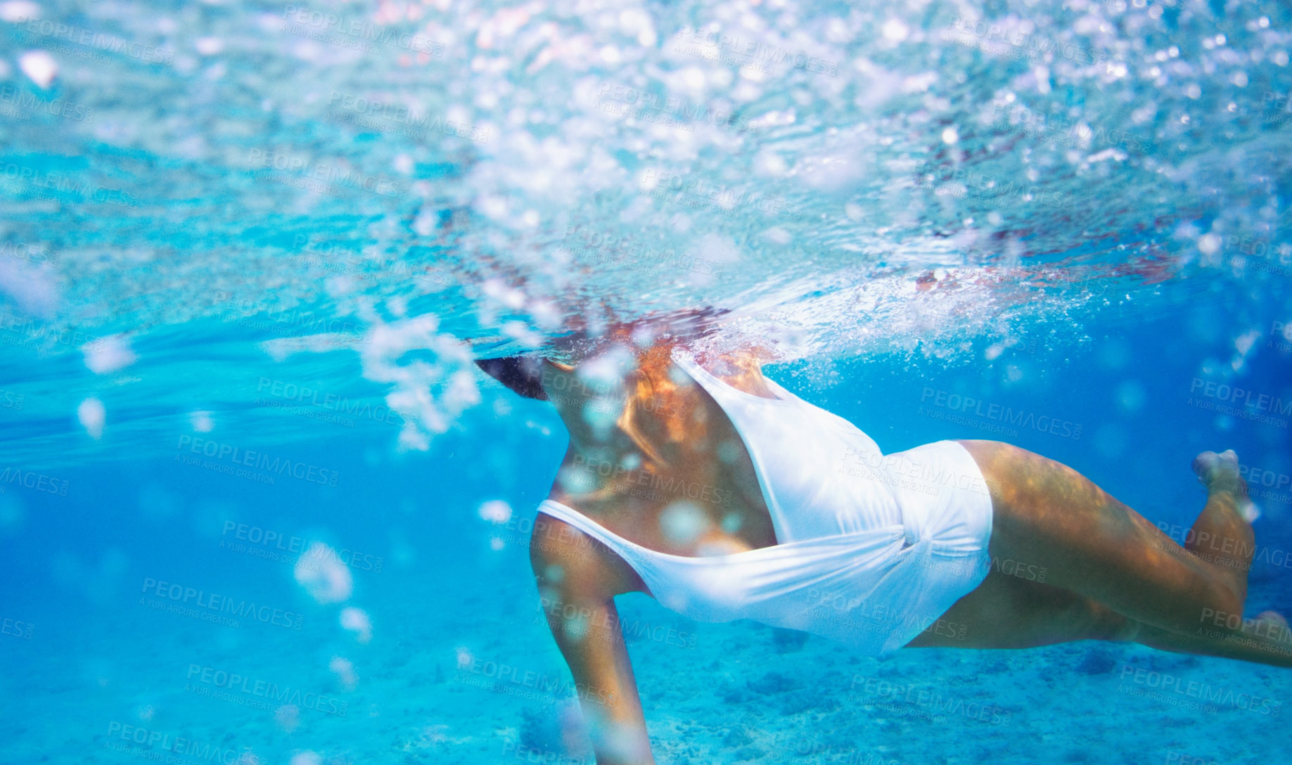 Buy stock photo Underwater, environment and woman swimming in the ocean for travel, freedom or adventure in tropical nature. Sea, swimwear and a person diving to explore or discover a deep blue wilderness in summer
