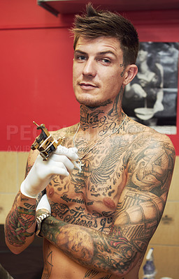 Buy stock photo Portrait of a handsome young tattoo artist with tattoos on his upper body