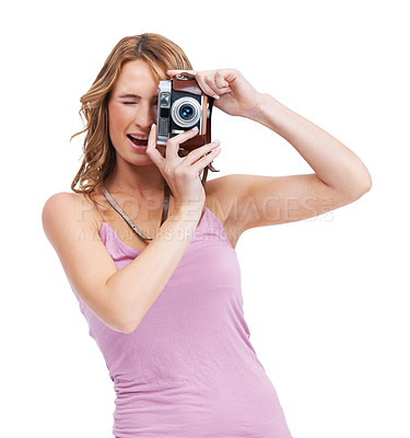 Buy stock photo Studio shot of a young woman taking a picture with a vintage camera