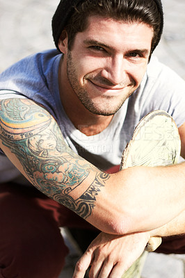 Buy stock photo Portrait of a young man showing off his beautiful Art Nouveau style tattoo