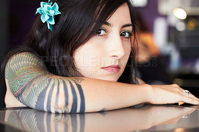 Buy stock photo Beauty, tattoo and portrait of woman in parlor for body art, design and creativity in ink shop. Face, artist and serious female person with flower in hair with cosmetics, natural beauty and tattoos