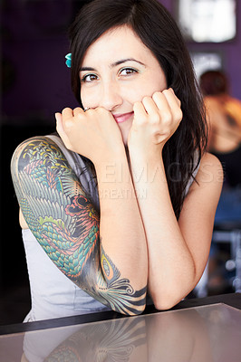 Buy stock photo Portrait of a female tattoo artist showing off her half-sleeve tattoo