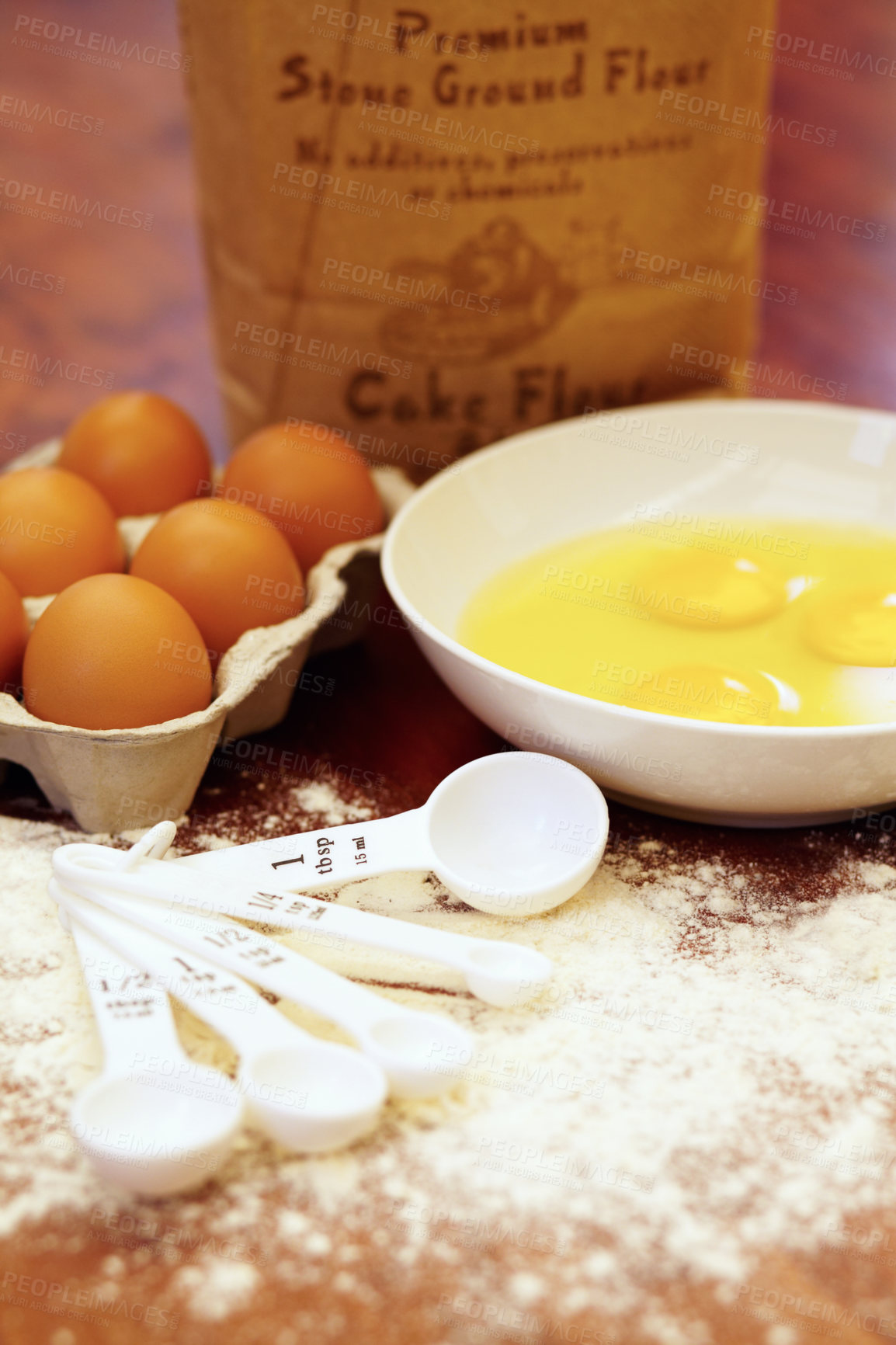 Buy stock photo Shot of a variety of ingredients and measuring implements on a wooden table