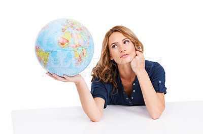 Buy stock photo An inquisitive young beauty holding a globe of the Earth with Africa facing the camera