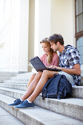 Buy stock photo University, education and students with laptop on building steps for team project research. Learning, studying and gen z friends online on stairs with book for assignment, exam or homework discussion