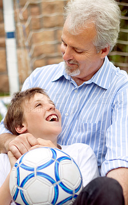 Buy stock photo Senior, man or boy with smile and ball for football, sport or bonding in backyard, garden or field. Family, elderly person or son with happiness for soccer match, game or performance at home for care