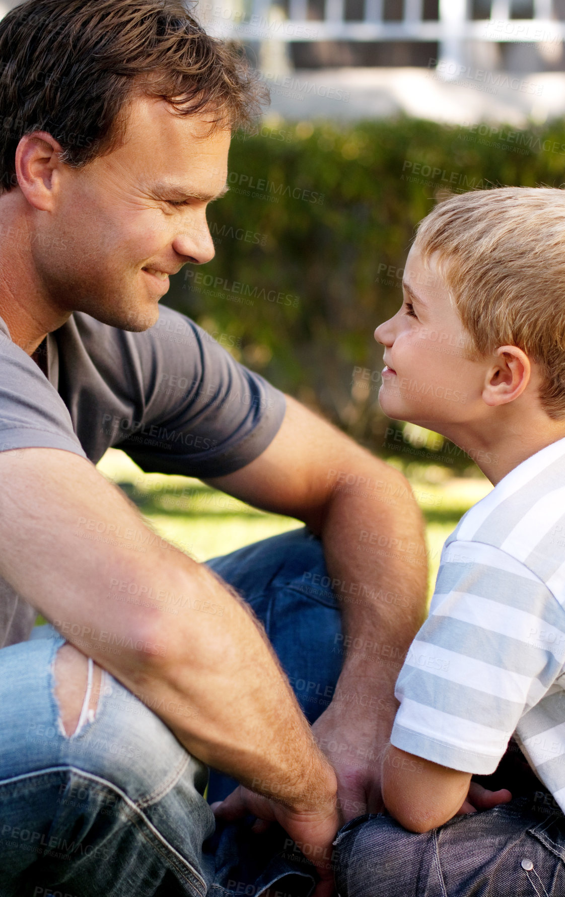 Buy stock photo Smile, father and boy sitting on grass, cute bonding together with care and love in home backyard. Outdoor fun, dad and child on lawn in garden, playful with trust and support with happy man and son.