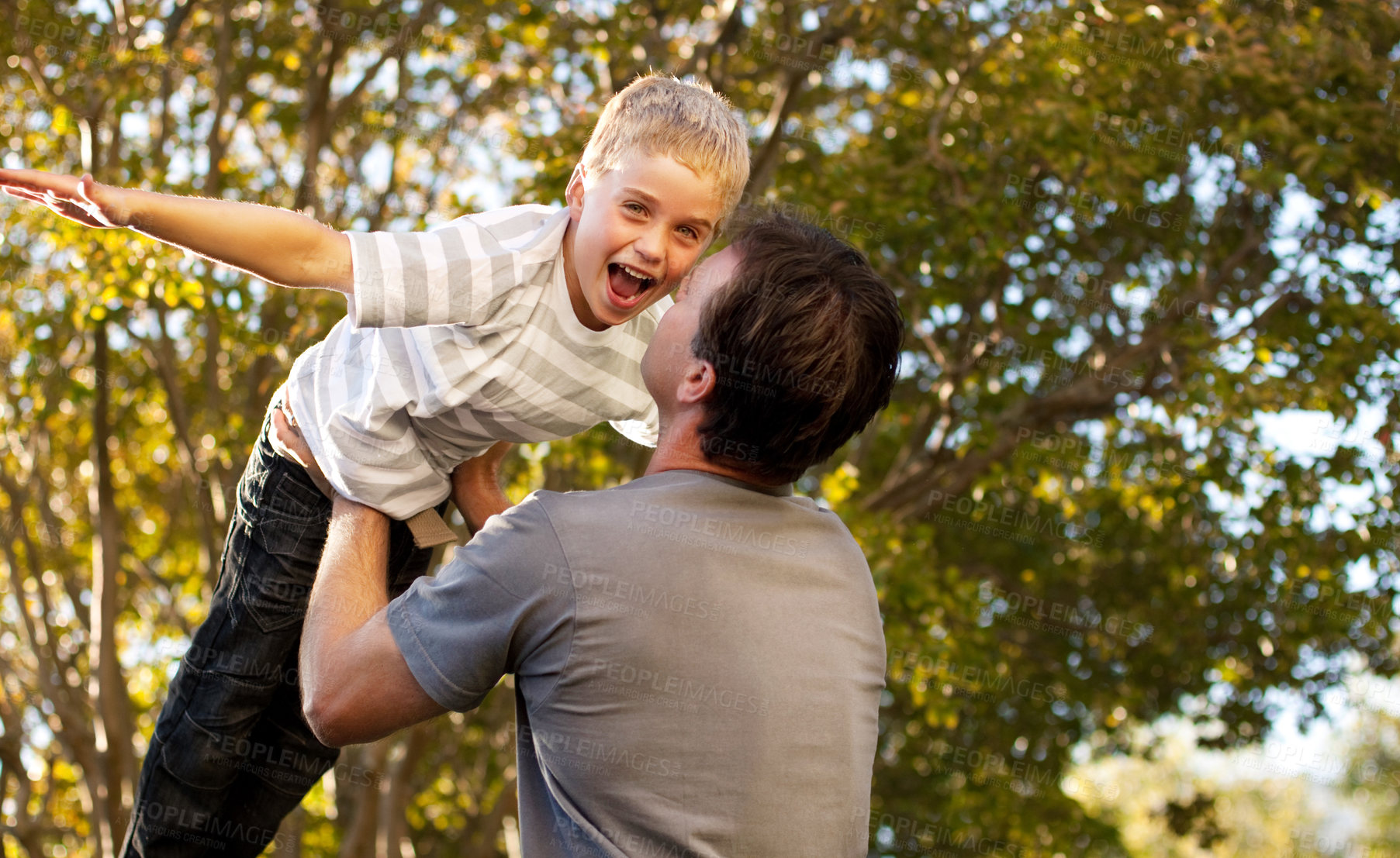 Buy stock photo Father, child and backyard with airplane game, happy bonding and fun morning playing for dad and son. Outdoor fun, love and playful energy, man holding boy in air and laughing in garden together.