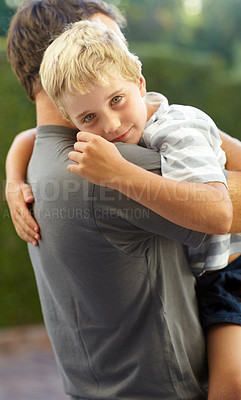 Buy stock photo Portrait of dad hugging kid in backyard, support and bonding together in comfort, care and love. Smile, father and face of child in garden with happy relationship, trust for man and boy or family
