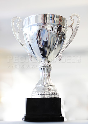 Buy stock photo Trophy, reward and celebration award as an achievement for winning a silver prize due to success of a champion. Shine, cup and victory championship with value for a winner in a competition