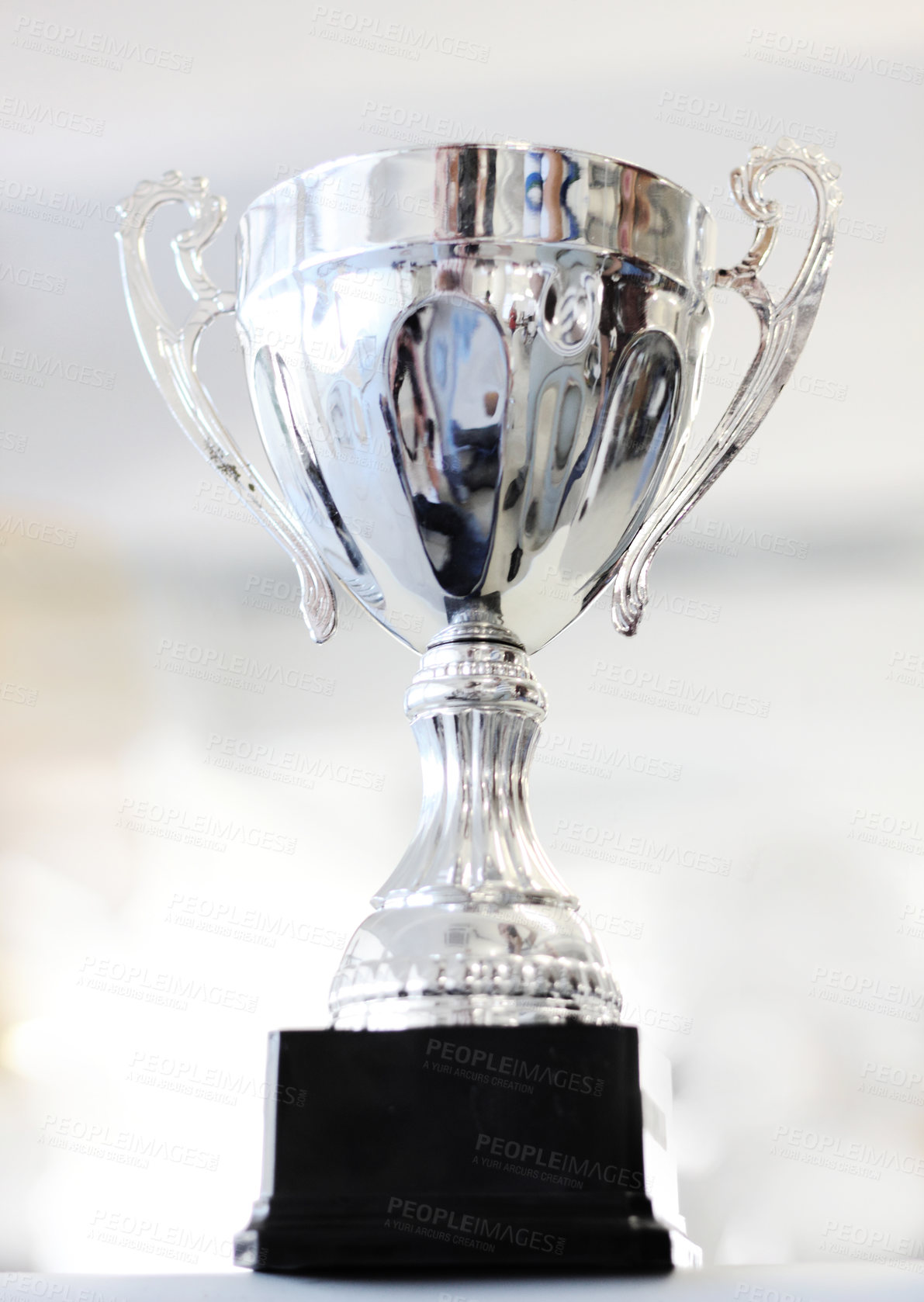 Buy stock photo Trophy, reward and celebration award as an achievement for winning a silver prize due to success of a champion. Shine, cup and victory championship with value for a winner in a competition
