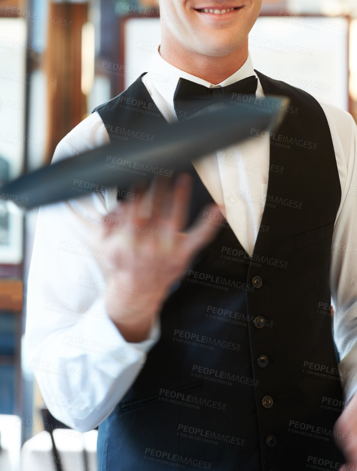 Buy stock photo Hand, service and waiter with a tray in restaurant, event or funny trick with catering employee. Happy, server and man in luxury, fine dining and hospitality of bartender serving at club or hotel