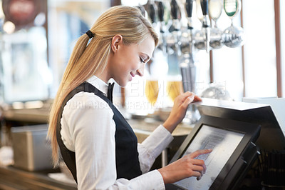 Buy stock photo Cashier, barista and young woman waitress in cafe checking for payment receipt. Hospitality, server and female butler from Canada preparing a slip at the till by a bar in coffee shop or restaurant.
