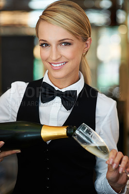 Buy stock photo Champagne, glass and portrait of woman waitress in a elegant restaurant, event or dinner. Happy, smile and young female butler from Australia pour alcohol wine at a luxury party or celebration.