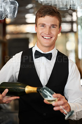 Buy stock photo Man, bartender and waiter with champagne at restaurant for happy hour, hospitality industry or customer service. Portrait of barman, server or catering employee smile, wine glass and alcohol bottle