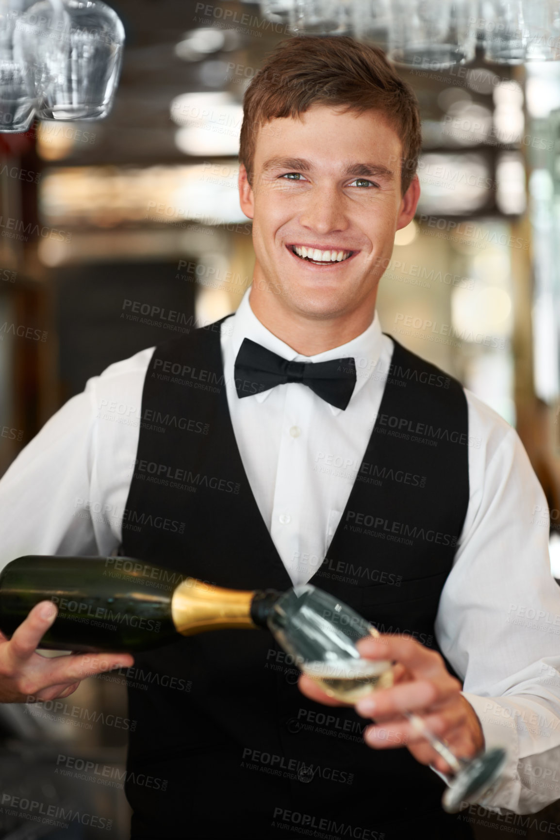 Buy stock photo Man, bartender and waiter with champagne at restaurant for happy hour, hospitality industry or customer service. Portrait of barman, server or catering employee smile, wine glass and alcohol bottle