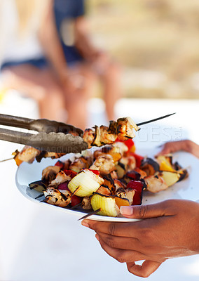 Buy stock photo Closeup of a plate of chicken kebabs straight from the barbeque