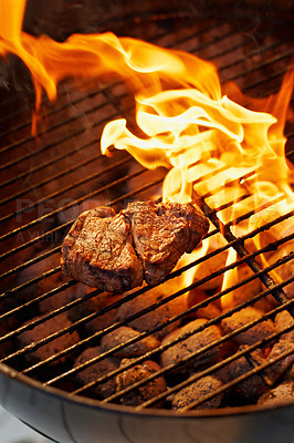 Buy stock photo Barbecue, food and steak on a fire for dinner, eating meat and cookout on the grill. Protein, flame and food grilling for a bbq and preparing beef for supper for hunger or health outdoors at home