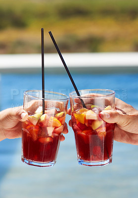 Buy stock photo Closeup of two friends toasting each other with their glasses