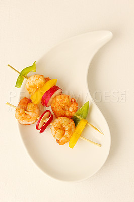 Buy stock photo Prawn, kebab and food on plate with shrimp, vegetables and luxury menu, meat or fine dining mockup. Grilled, seafood and creative presentation of gourmet appetizer on skewers in restaurant or studio
